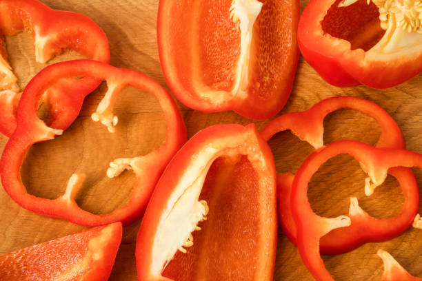 istock red bell pepper cut into pieces on a wooden board 1195426834