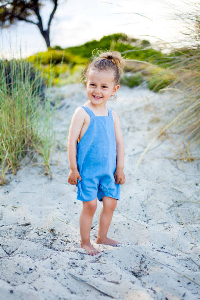 istock cute girl at the beach 1195427497
