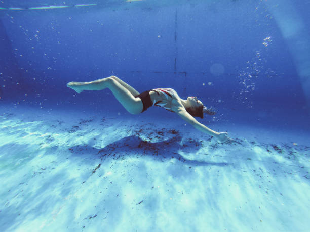 istock Skilled underwater act performed by a young woman 1195429338