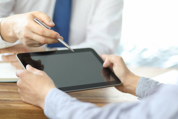 istock Business team meeting to discuss statistical data presented in the form of digital graphs and charts 1195430155