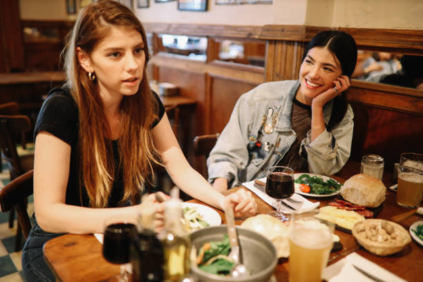 istock Friends eating and drinking in Buenos Aires restaurant 1195430504