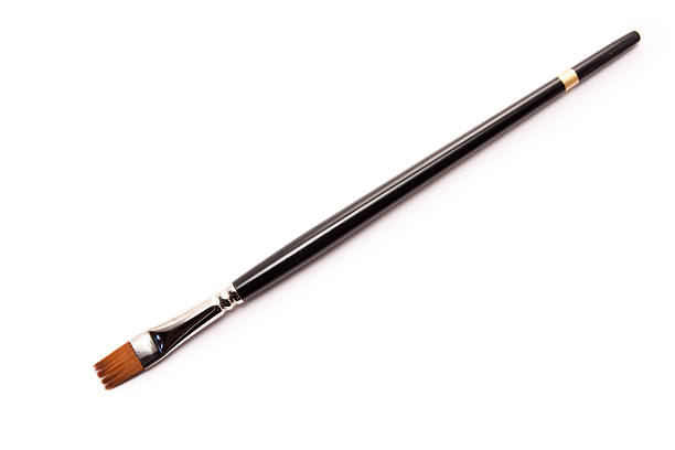 istock Artists Paint Brush Black and Gold Isolated on White Background 119543194