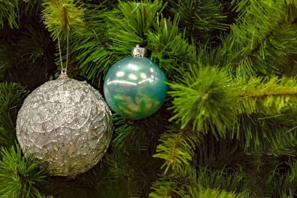 istock Silver and turquoise balls -  toy hang on  Christmas tree. 1195437210
