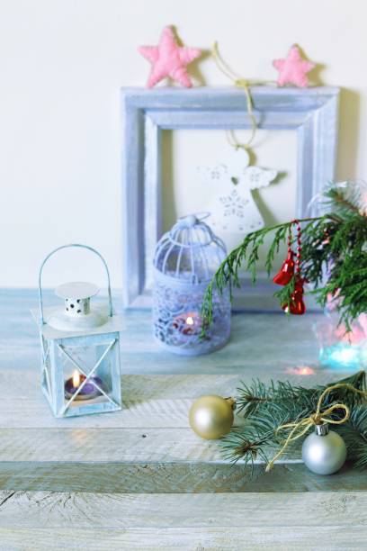 istock On a wooden table Christmas ball, cones, spruce branches, decorative lights, illumination 1195439841