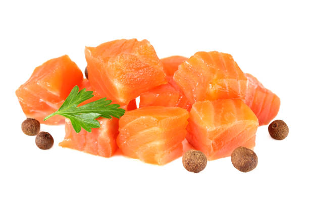 istock Red fish. Raw salmon fillet with parsley and peppercorns isolate on white background 1195442489