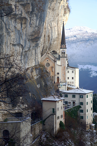 Sanctuary of Holy Mary of the Corona in Spiazzi, Italy, after a light snowfall