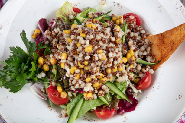 istock Mexican Quinoa Salad with tomatoes, corn and beans. 1195446124