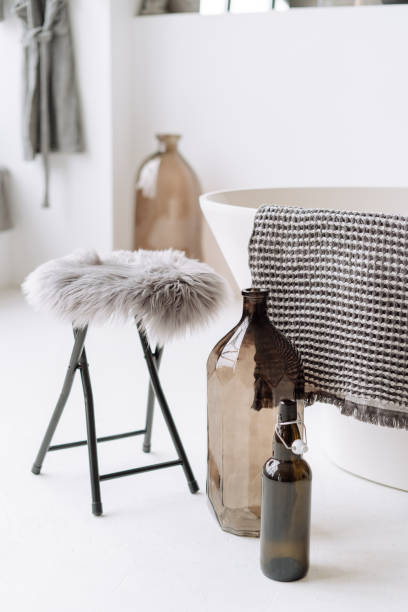 istock Stool with Fluffy Seat, Glass Bottles and Towel 1195447631