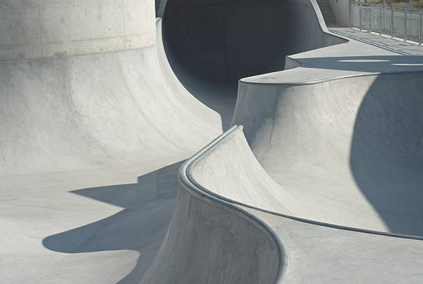 Empty skatepark, skateboarding park in city at sunny day.