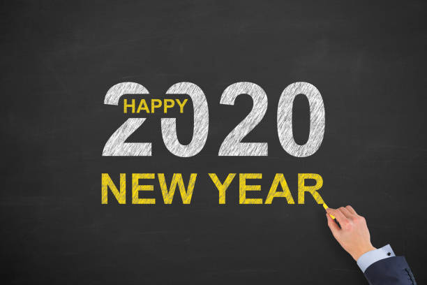 istock Happy New Year 2020 on Blackboard Background 1195450876