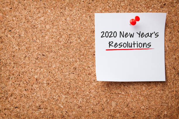 istock White Sticky Note With New Year 2020 Resolutions And Red Push Pin On Cork Board 1195451944
