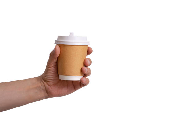 istock Paper cup for coffee in hand on a white background 1195453474