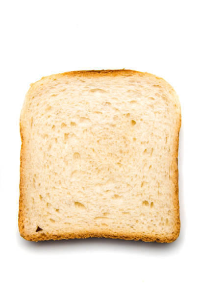 Slice of bread with spread on top stock photo