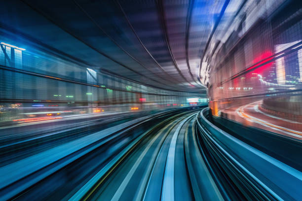 Tokyo Japan High Speed Train Tunnel Motion Blur Abstract High speed train driving along the rails through a train station tunnel at night. Motion Blur. Long Exposure. Edited, Composite Night Skyline. Odaiba, Tokyo, Japan, Asia japan photos stock pictures, royalty-free photos & images