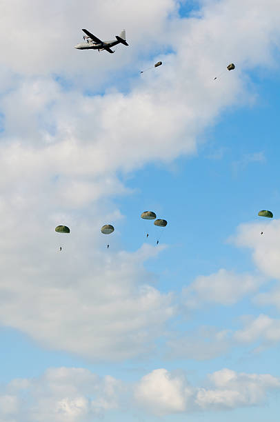 istock Military aircraft dropping paratroopers 119545616