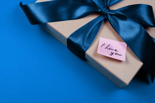 istock craft box with beautiful big blue bow 1195460093