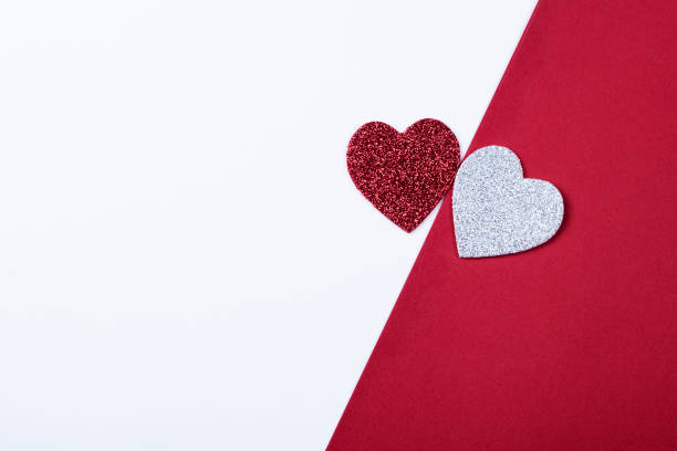 istock Romantic background with beautiful red and white hearts with sequins 1195460106