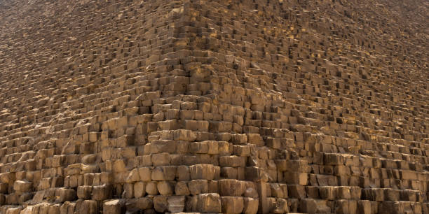 Khufu pyramid in Giza stone block texture Khufu pyramid in Giza stone block texture, close up of Great Pyramid stone cube in Cairo pyramid giza pyramids close up egypt stock pictures, royalty-free photos & images