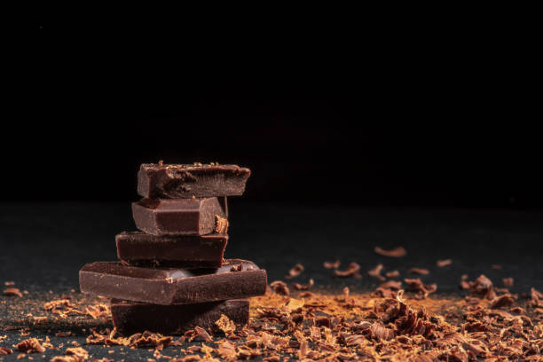 istock dark chocolate on a stone. Dark background. 1195467517