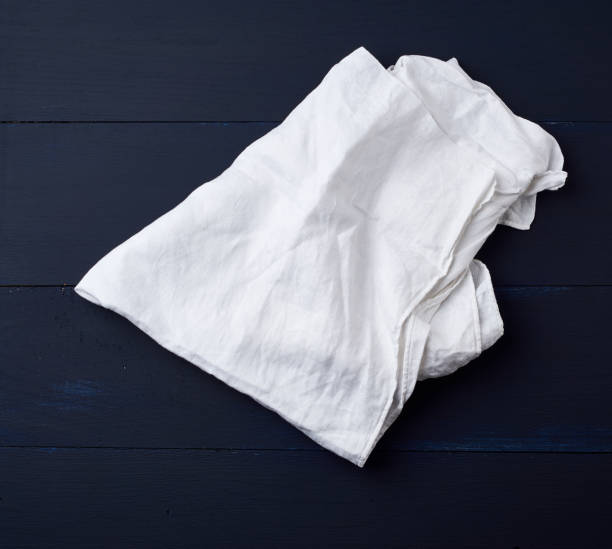istock white linen towel on blue wooden background 1195468390