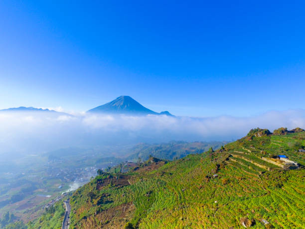 istock Mountain landscape with peaks covered by clouds 1195472535