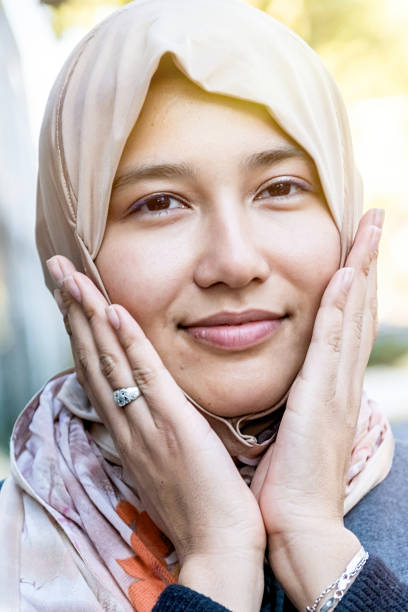 istock Smiling muslim female asian college student 1195473784