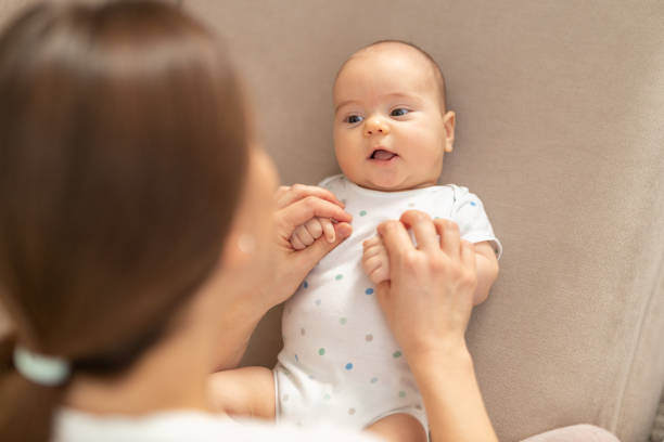 istock Smiling baby and his mom 1195477265