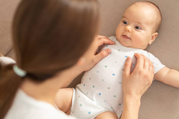 istock Smiling baby and his mom 1195477322