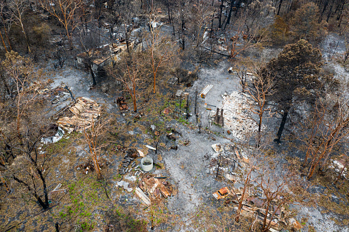 Aerial view of Australian bush fire destruction with a burnt home & property