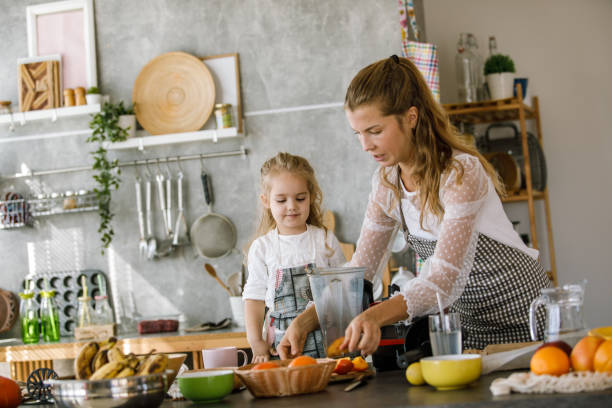 istock Mother and her little assistant making a vegan dessert 1195481524