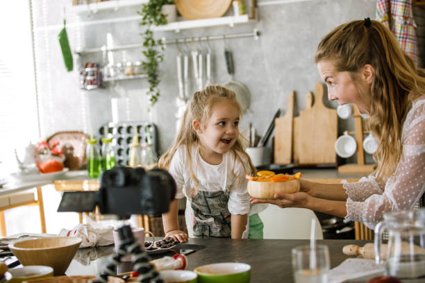 istock Having fun while filming a food related video together 1195481620