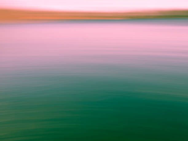 istock Blurred motion background with green, pink and orange gradient 1195491071