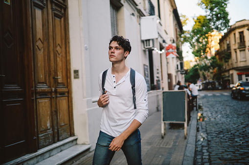 Handsome young man walking in the streets of Buenos Aires, Argentina.