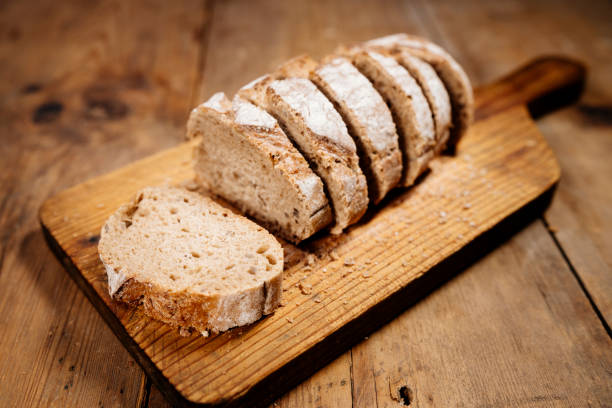 istock slices of bread on wooden board 1195498132