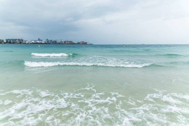 Dramatic Cloudy Sky and Thunderstorm, Sea Waves at Jumeirah Beach in Dubai, UAE.