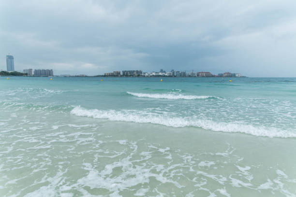 Dramatic Cloudy Sky and Thunderstorm, Sea Waves at Jumeirah Beach in Dubai, UAE.