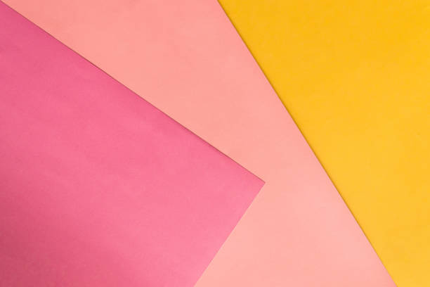 istock Abstract pink and yellow papers stacking together in abstract form. Abstract color paper background. 1195502196