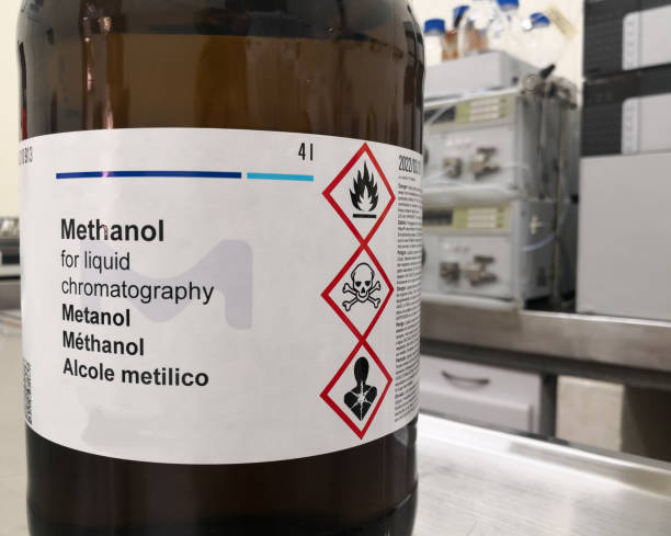 istock Methanol, an HPLC grade alcohol, and a label with GHS warnings 1195504789
