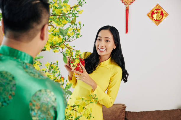 istock Couple decorating house for Lunar New Year 1195506165