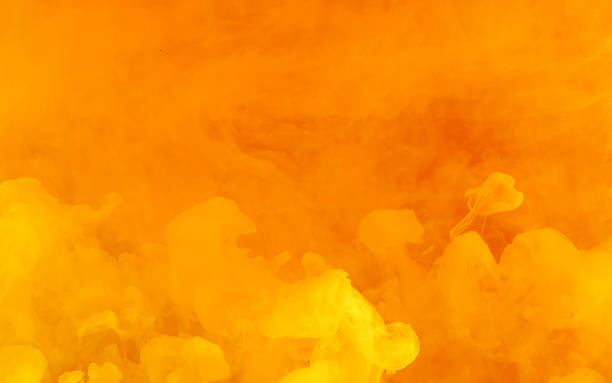 fondo abstracto amarillo-naranja ardiente. elegante fondo de tecnología moderna. - ink spread fotografías e imágenes de stock