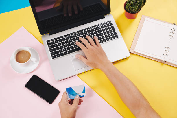 istock Man shopping online with credit card 1195506899