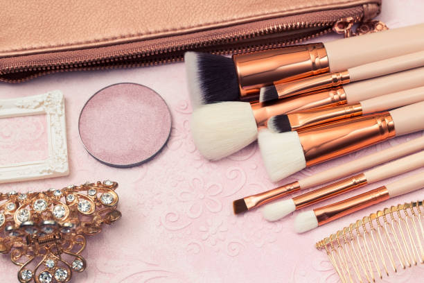 istock Professional makeup brushes, Golden bronzer and blush, Foundation and various cosmetics 1195508545
