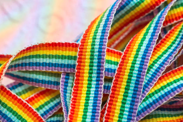 istock Rainbow symbol, colorful ribbons close up, rainbow design macro 1195509714