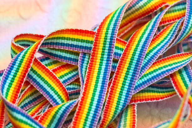 istock Rainbow symbol, colorful ribbons close up, rainbow design macro 1195509773