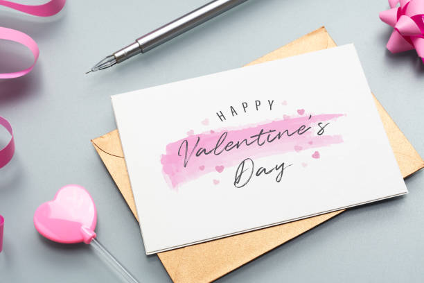 istock Mockup postcard and envelope on grey background with Happy valentines day, handy craft, gift box bow and pen. Mock up for elegant design. Flat lay top view valentine's day background. 1195514230