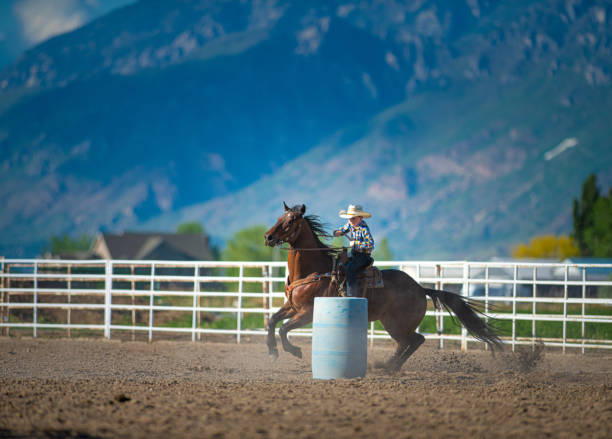 istock Young cowboy barrel racing rodeo 1195515850