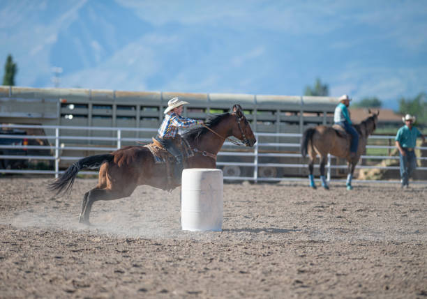 istock Young cowboy barrel racing rodeo 1195515864