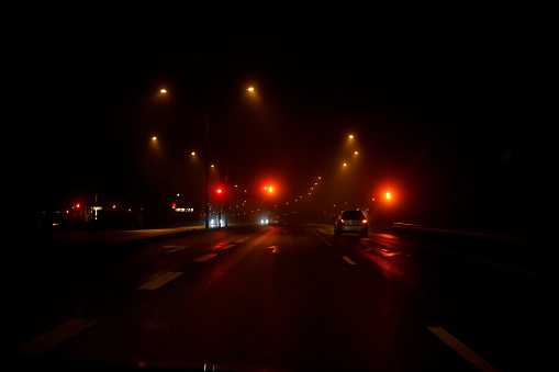 traffic light a dark and foggy night in Karlskoga Sweden december 2019