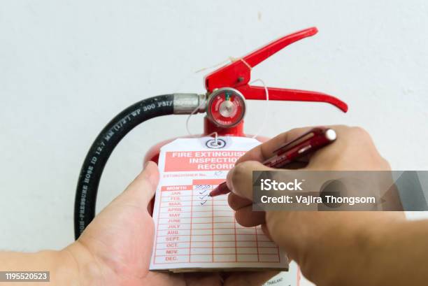 Fire Extinguisher Monthly Check List Stock Photo - Download Image Now - Fire Extinguisher, Fire - Natural Phenomenon, Examining