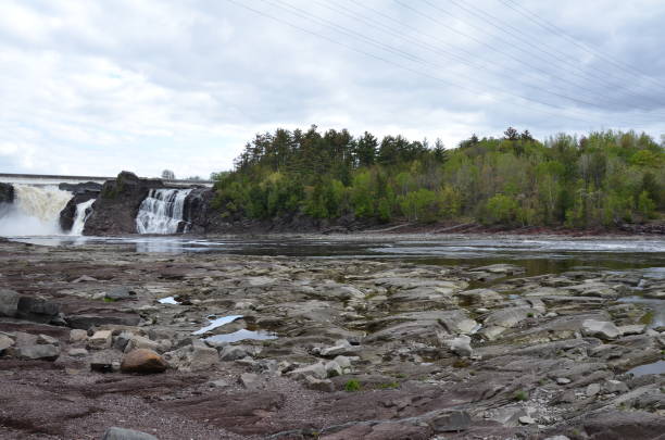 istock waterfall in Canada with river and rocks and trees 1195522267